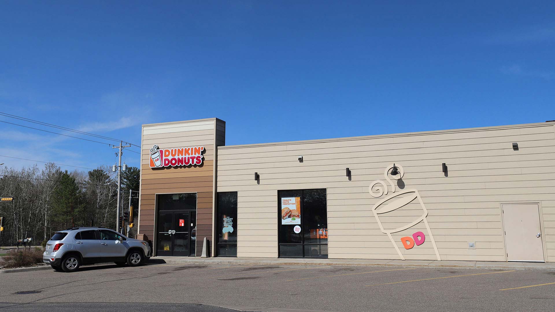 Exterior of Dunkin Donuts with sign