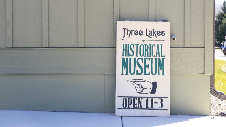 Three Lakes Historical Museum entry sign