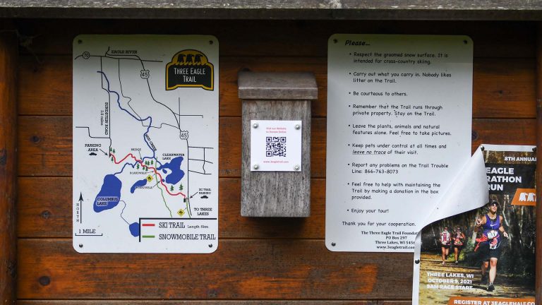 Three Eagle Trail sign with a map and information