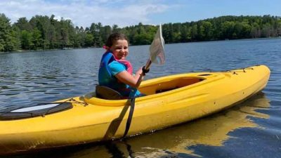 Woman kayaking the lake
