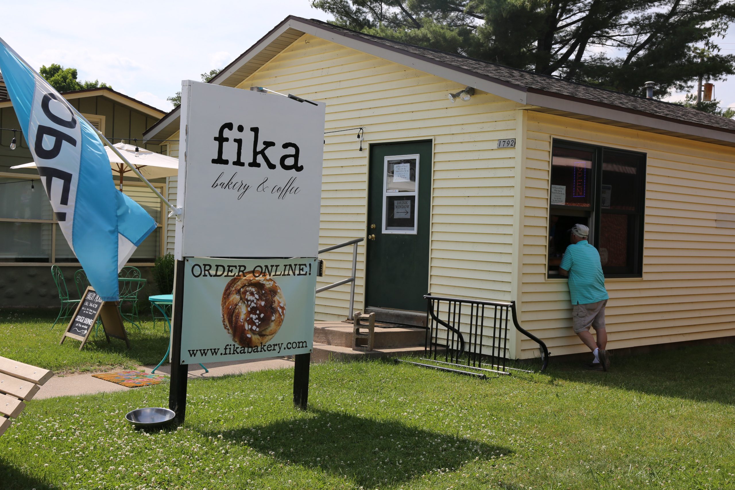 Fika Bakery & Coffee | Man standing at entrance to cute Bakery