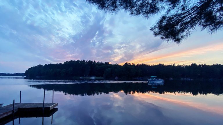 Related Article: Book the perfect  getaway—with all the amenities you want | Sunset over lake Oneida County Wisconsin