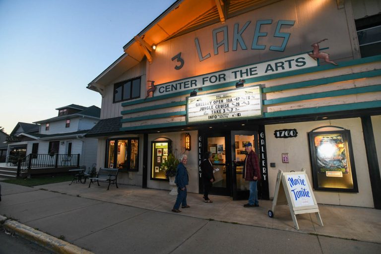 People entering the Three Lakes Center for the Arts