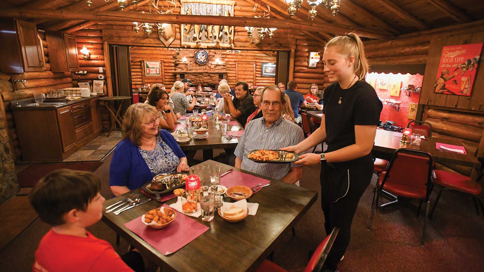 Family being served food at Al Gen Dinner Club in Rhinelander