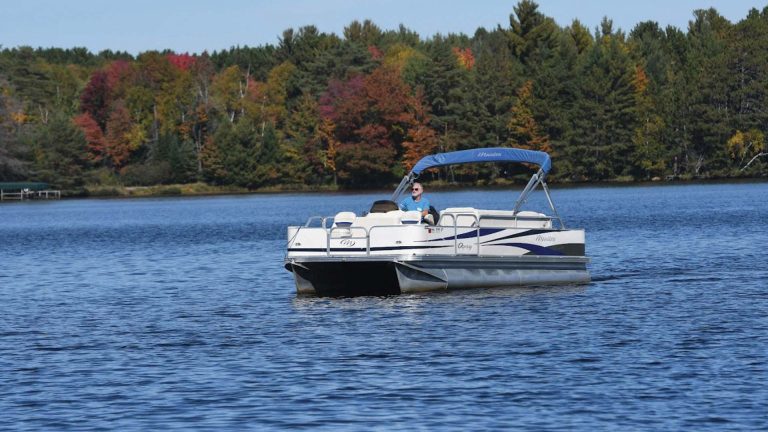 Pontoon boating the waterways in fall
