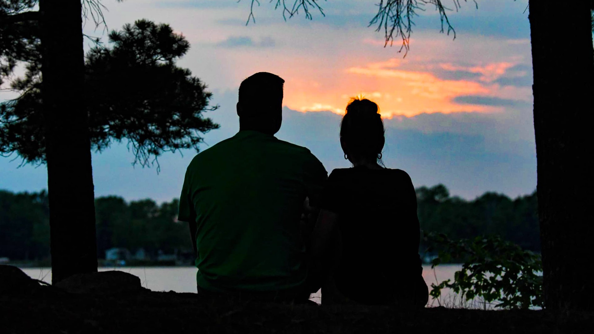 Couple watching sunset at Shady Rest Lodge Rhinelander Wisconsin