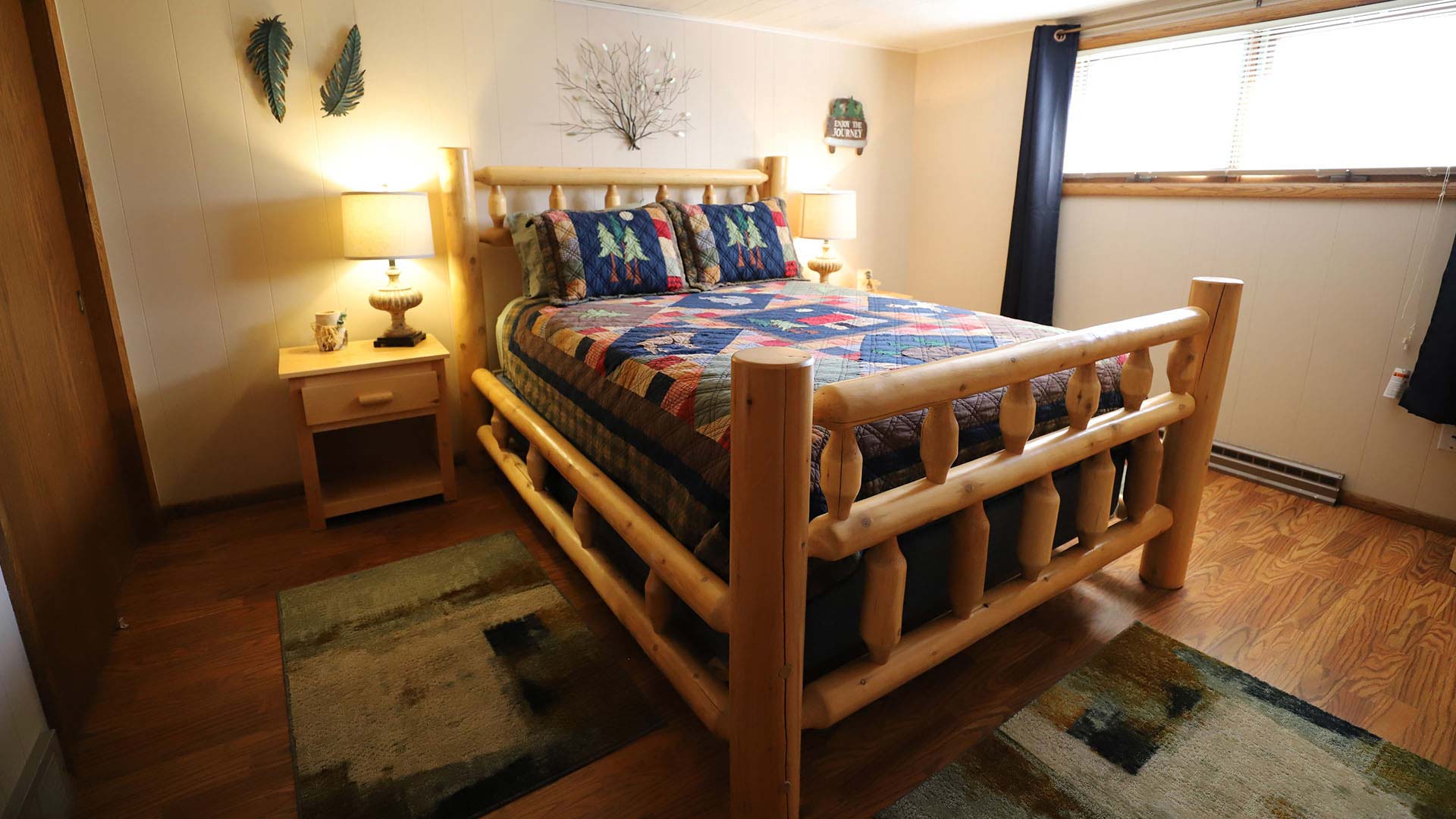 Explore Oneida County This Spring | Bedroom on display at Lake Tomahawk Lodge