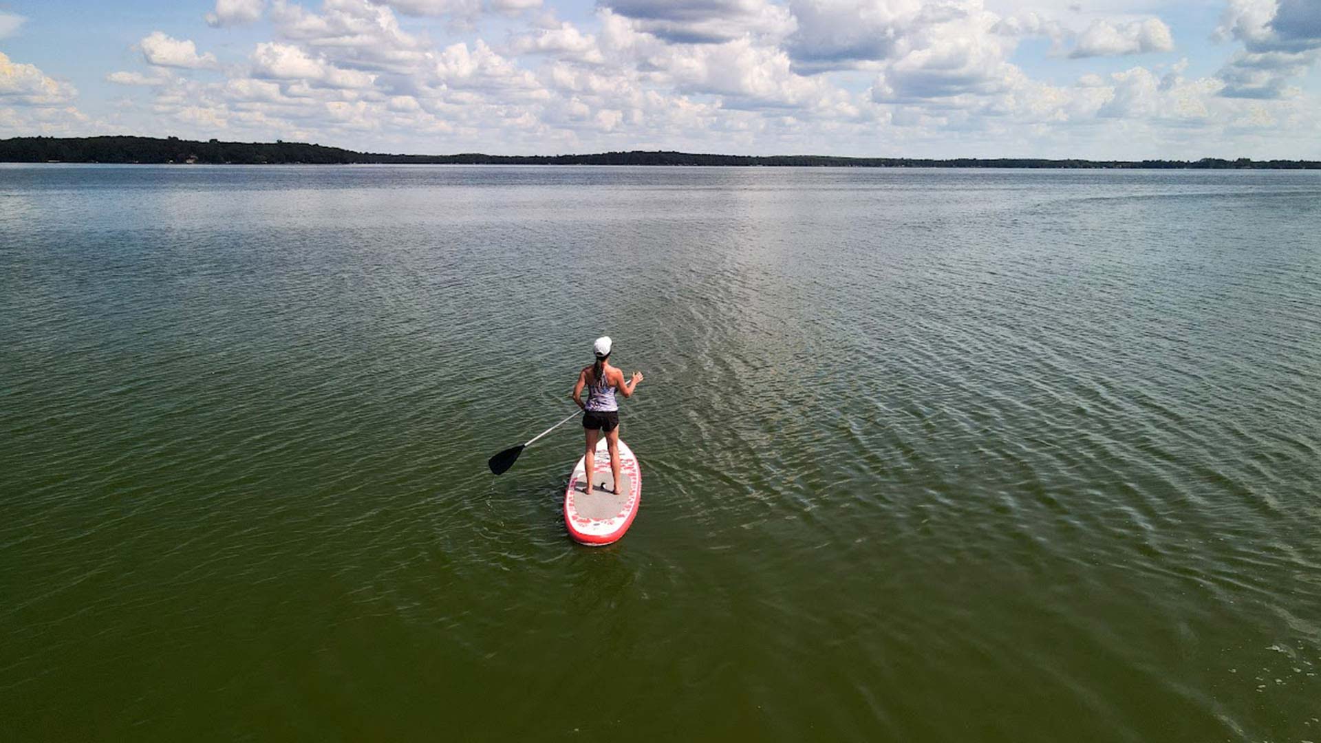 Canoeing, Kayaking & Paddleboarding | Woman paddleboarding Pelican Lake