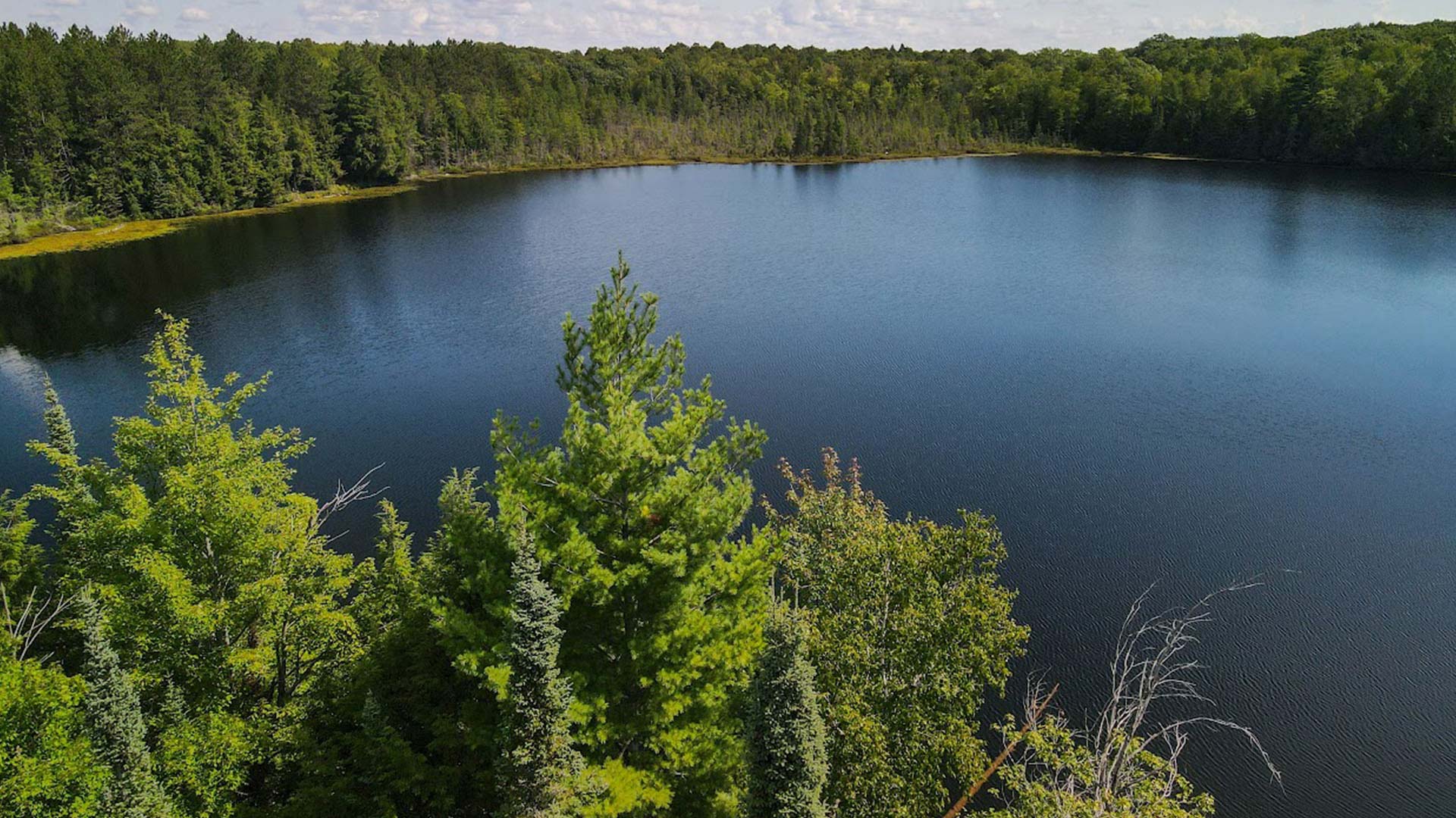 Visit Oneida County This Summer | Scenic overhead shot of Eagle Lake
