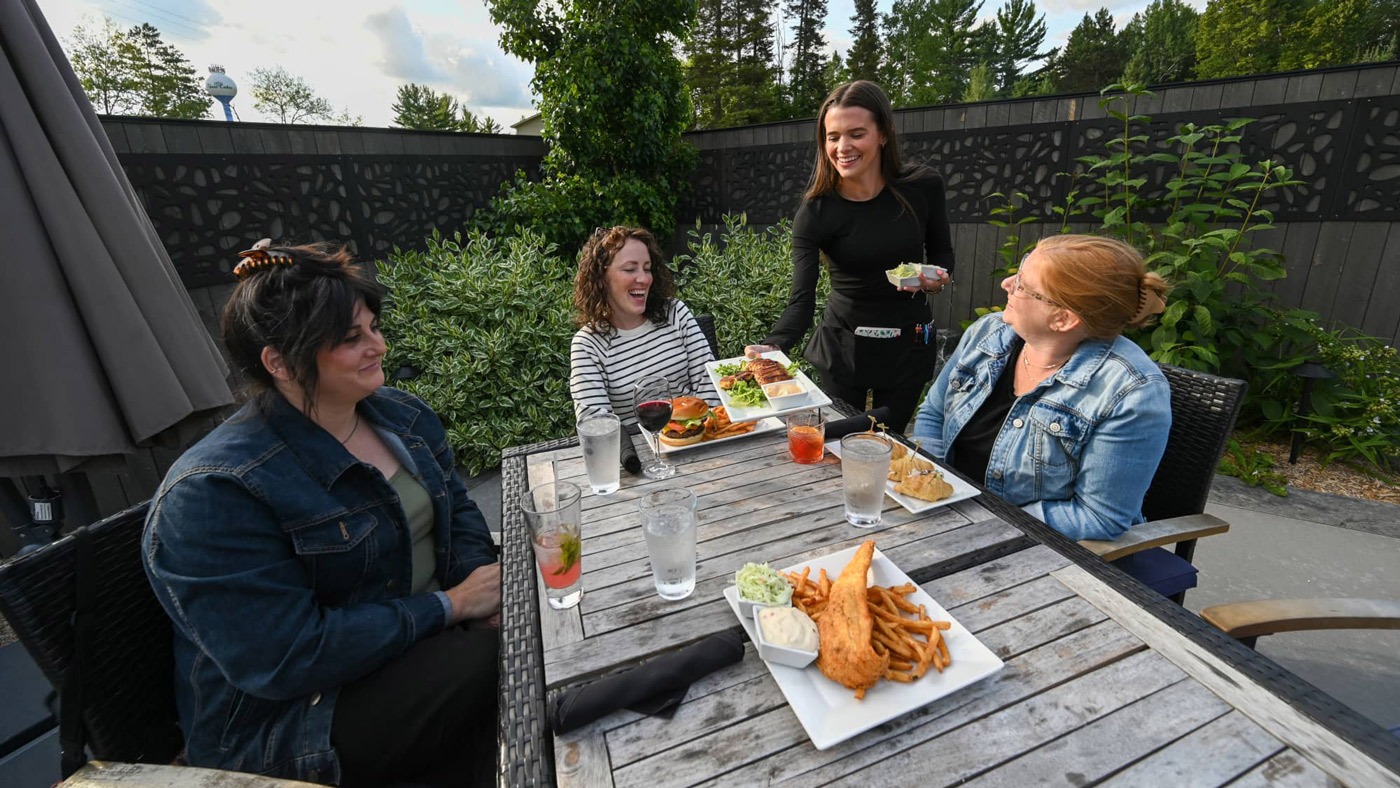 Organic, locally sourced & ethnic dining options in Oneida County | Women dining at Clayton’s 1881 Room in Three Lakes Oneida County WI