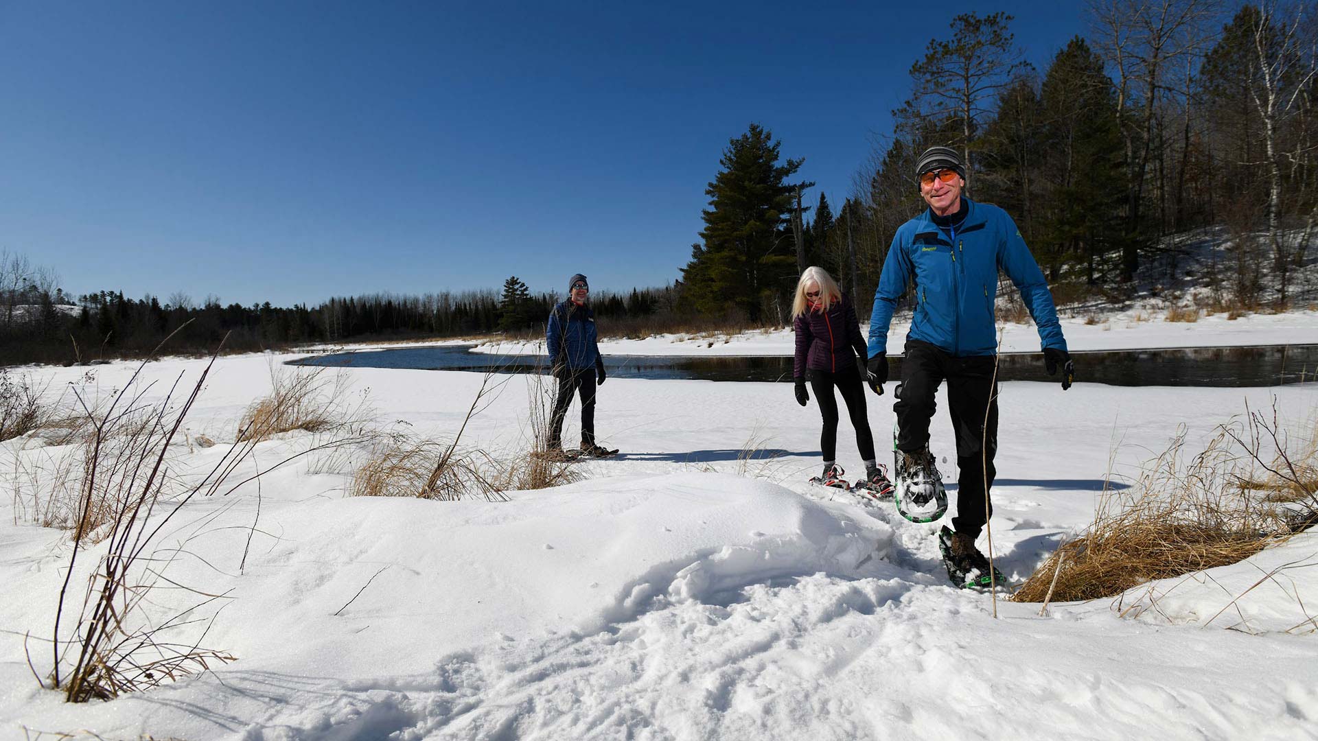 WINTER FUN IN ONEIDA COUNTY | Snowshoers walking on the trail at Minocqua Winter Park