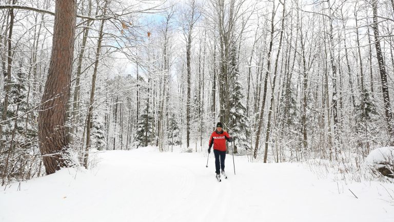 Related Article: Great winter trails for hiking, snowshoeing & skiing | Woman cross-country skiing on the Washburn Trail near Rhinelander WI