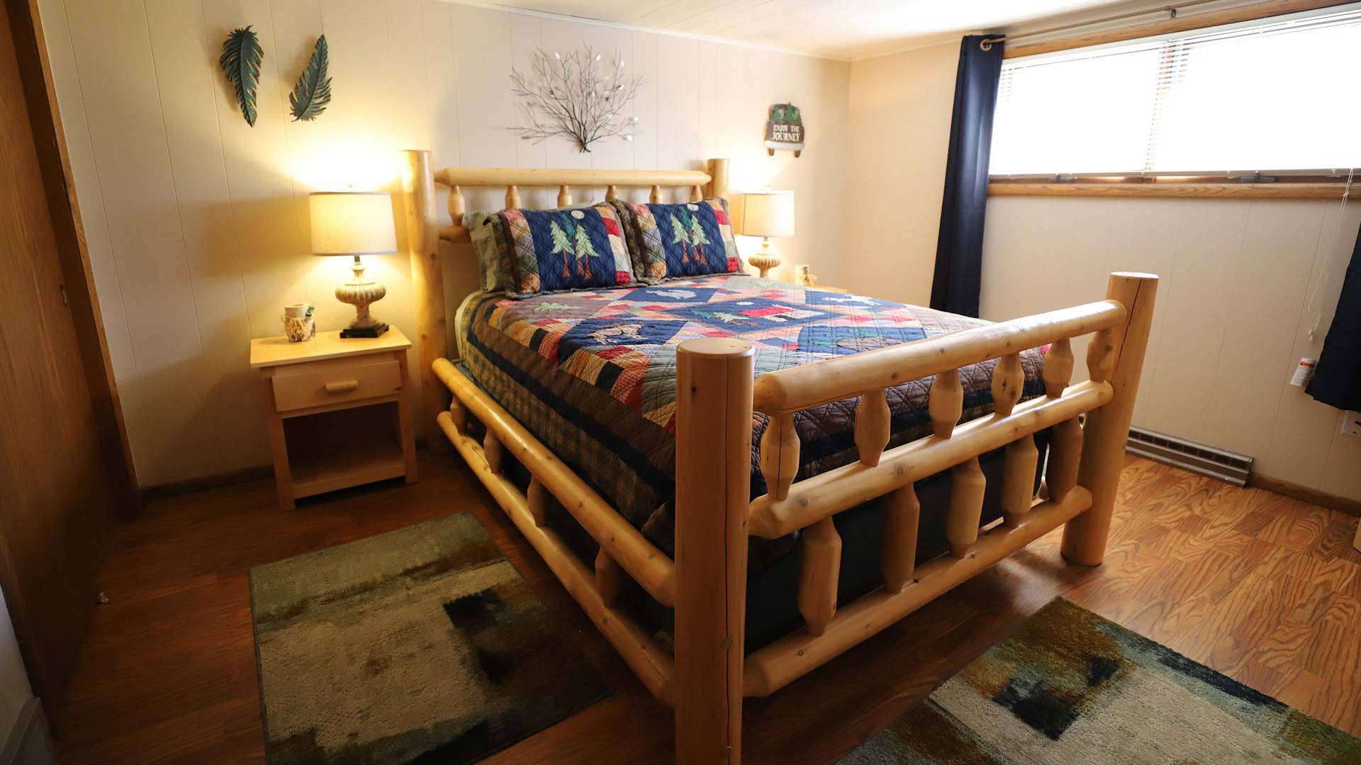 Lodging | Log cabin inspired bedroom at Lake Tomahawk Lodge