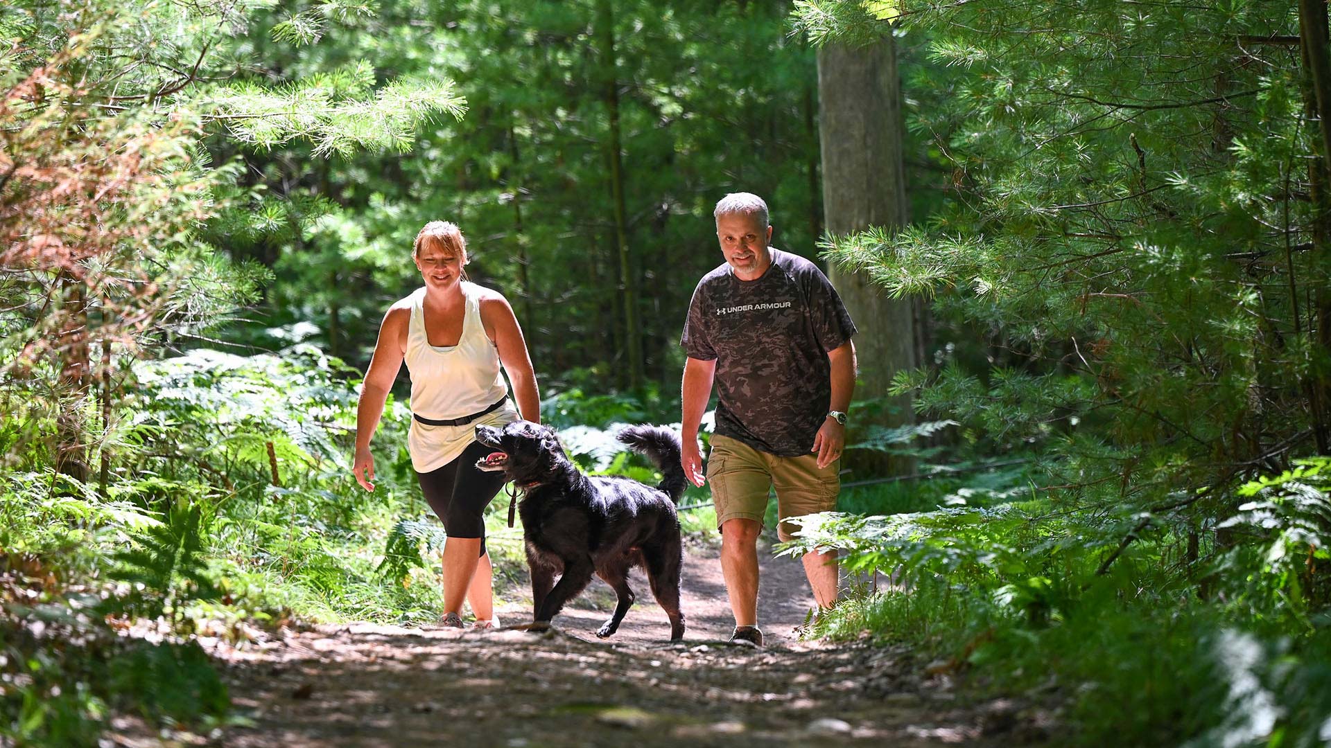Hiking | Man and woman hiking with their dog
