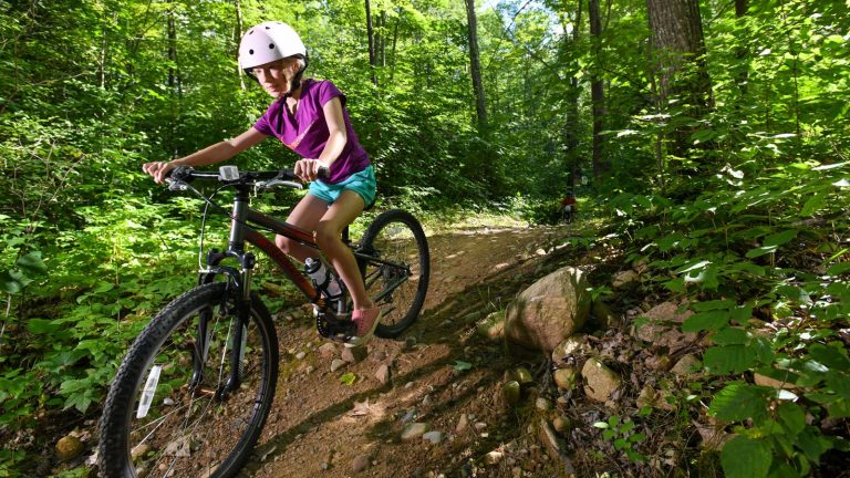 Related Article: 5 great mountain bike trails in Oneida County | Girl mountain biking on the Washburn Lake Trail in Woodboro in Oneida County Wisconsin