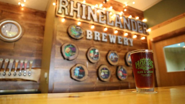 Related Article: 2 breweries to visit in the Northwoods | Beer in a Hodag Ale pint glass at the bar at Rhinelander Brewery taproom in downtown Rhinelander Wisconsin