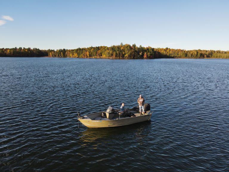 Fishing & boating | Men fishing on boat during fall season
